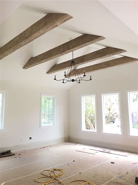 how to box in a steel beam with wood|vaulted ceiling with faux beams.